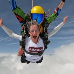Amanda free falling in a tandem skydive