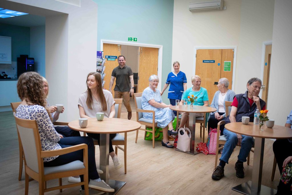 People socialising in our Therapy and Wellbeing Centre.